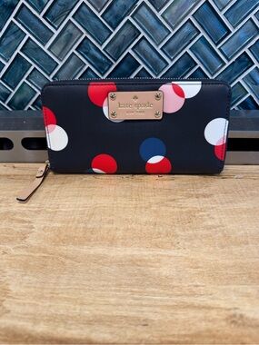 kate spade navy polka dot zip-around wallet- storybook lining